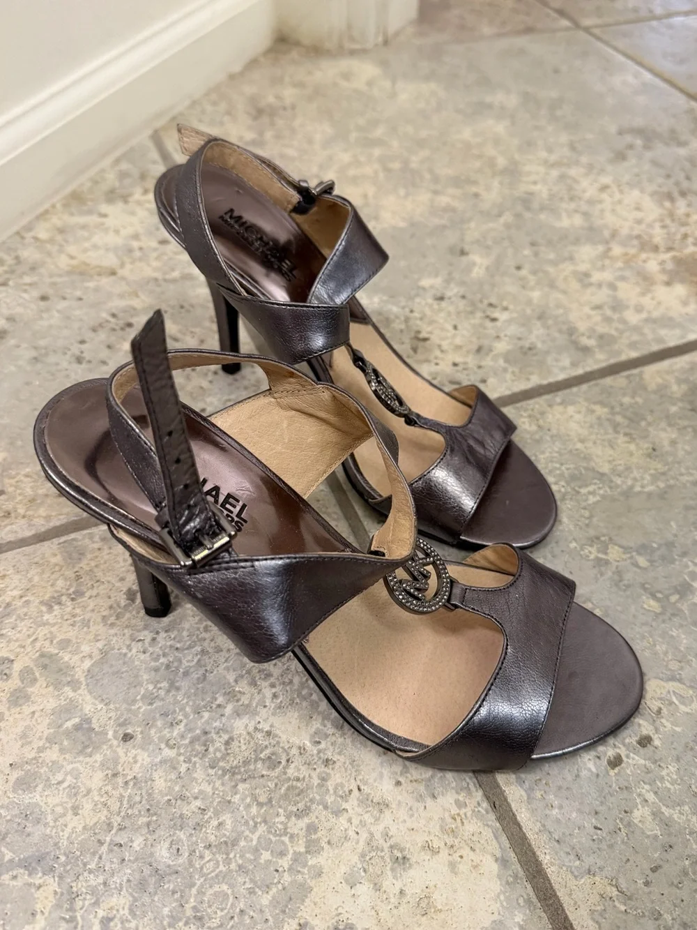 Michael Kors Shiny Silver Leather T-Strap Heels with MK Medallion Size 7.5